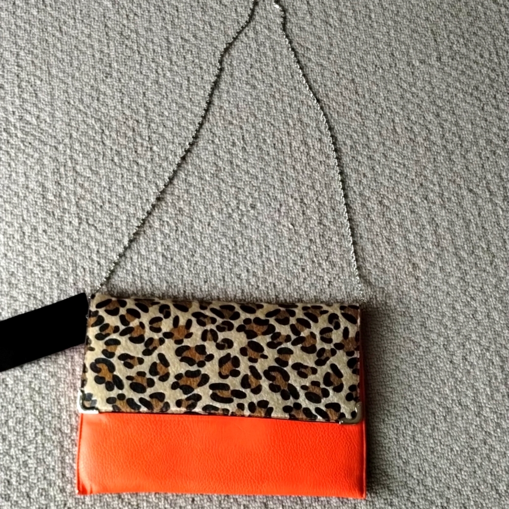 Say What clutch. orange and animal print. New with tags.